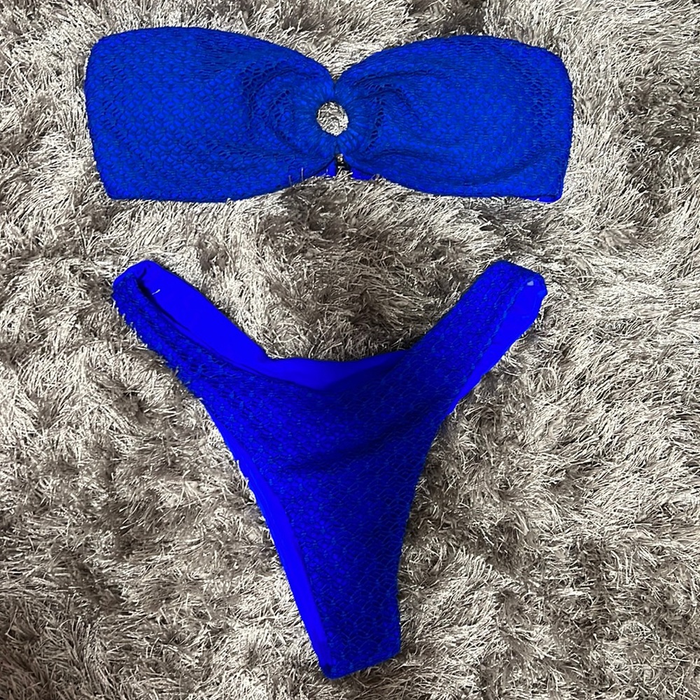 Blue with design bikini top strapless size medium. NEVER WORN.